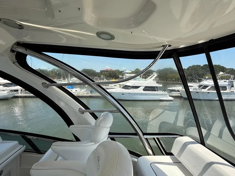 Slide: The Image of Interior view of 2007 Sea Ray 52 Sedan Bridge yacht with marina backdrop. - 19