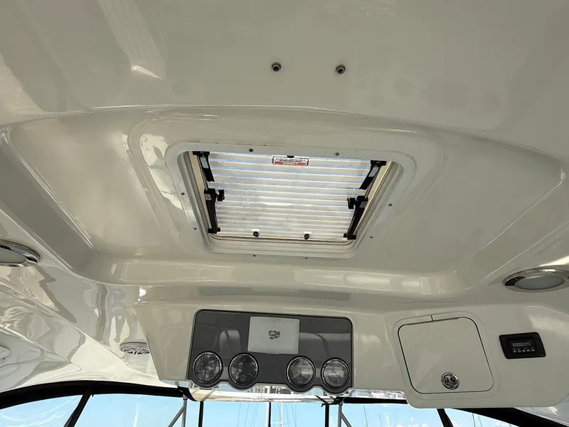 Slide: The Image of Ceiling view of 2007 Sea Ray 52 Sedan Bridge with hatch and control panel. - 22