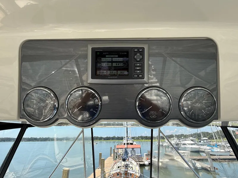 Slide: The Image of Dashboard of a 2007 Sea Ray 52 Sedan Bridge yacht with gauges and display. - 23