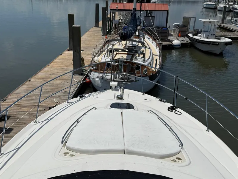 Slide: The Image of 2007 Sea Ray 52 Sedan Bridge docked at marina, viewed from bow. - 24