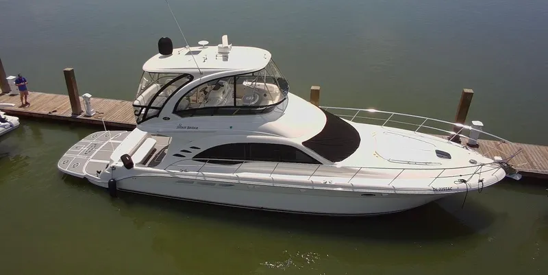 Slide: The Image of 2007 Sea Ray 52 Sedan Bridge yacht docked at marina. - 3