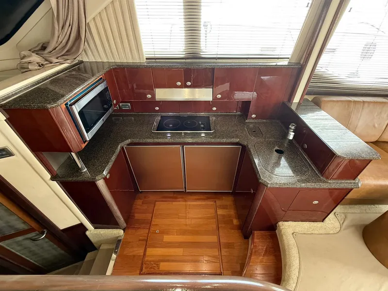 Slide: The Image of Luxurious kitchen interior of 2007 Sea Ray 52 Sedan Bridge yacht. - 31