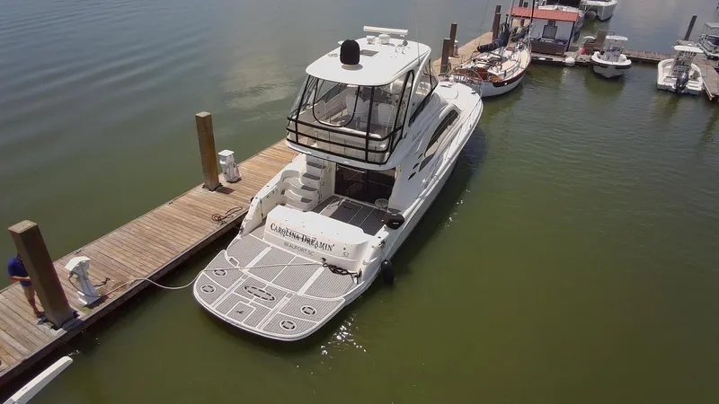 Slide: The Image of 2007 Sea Ray 52 Sedan Bridge yacht docked at marina, aerial view. - 4
