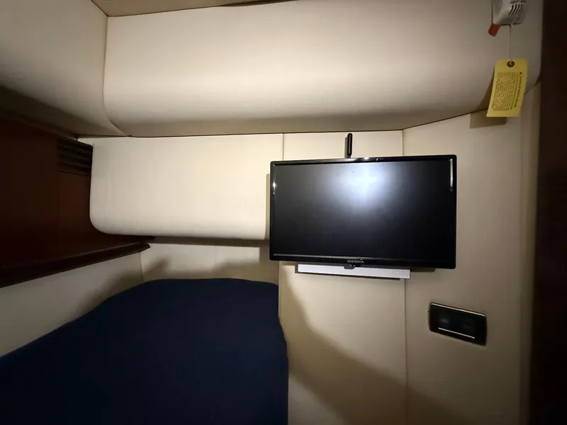 Slide: The Image of Interior cabin of 2007 Sea Ray 52 Sedan Bridge with mounted TV. - 41