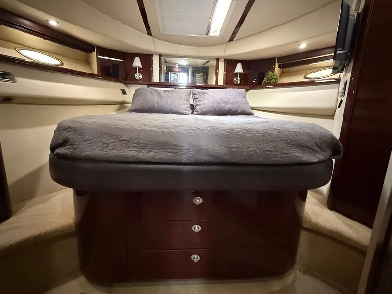 Slide: The Image of Luxurious bedroom interior of 2007 Sea Ray 52 Sedan Bridge yacht. - 42