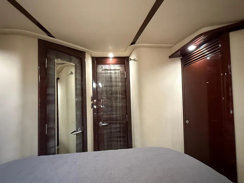 Slide: The Image of Luxurious interior of 2007 Sea Ray 52 Sedan Bridge yacht cabin with elegant wood finishes. - 46