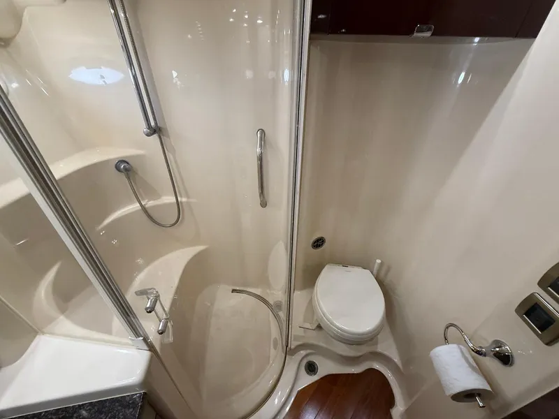 Slide: The Image of 2007 Sea Ray 52 Sedan Bridge bathroom with shower and toilet. - 49