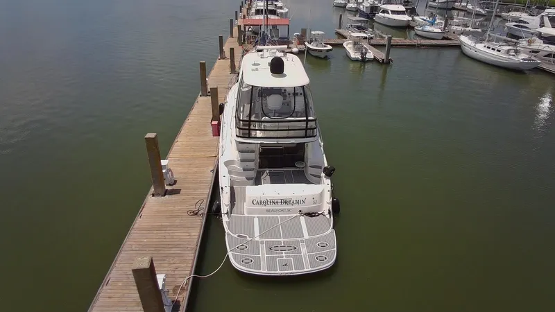 Slide: The Image of 2007 Sea Ray 52 Sedan Bridge yacht docked at marina, aerial view. - 5