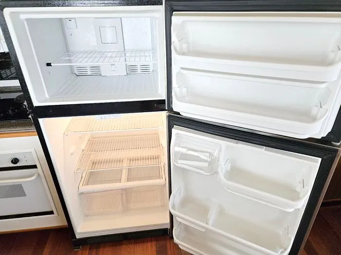 Slide: The Image of Empty refrigerator and freezer inside a 2000 Bayliner 5288 Pilot House Motoryacht. - 10