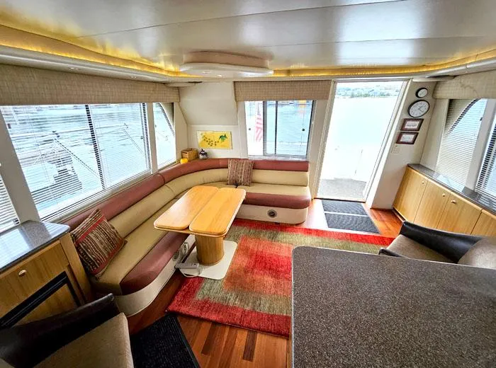 Slide: The Image of Luxurious interior of 2000 Bayliner 5288 Pilot House Motoryacht with elegant seating and decor. - 11