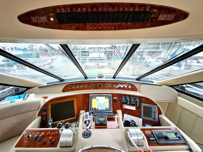 Slide: The Image of Cockpit of 2000 Bayliner 5288 Pilot House Motoryacht with navigation equipment and controls. - 13