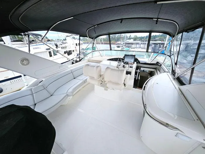 Slide: The Image of 2000 Bayliner 5288 Pilot House Motoryacht interior with helm, seating, and panoramic windows. - 15