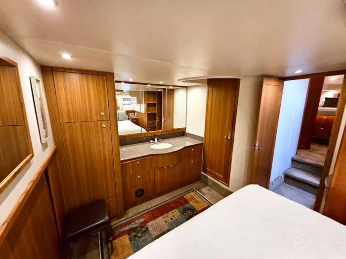 Slide: The Image of Luxurious interior of 2000 Bayliner 5288 Pilot House Motoryacht with wood cabinetry and modern amenities. - 24