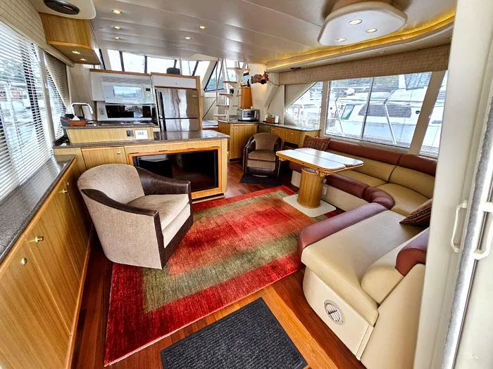 Slide: The Image of Luxurious interior of 2000 Bayliner 5288 Pilot House Motoryacht with modern furnishings. - 6
