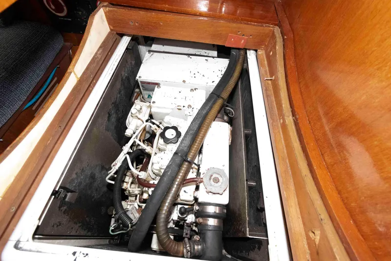 Slide: The Image of Engine compartment of 2006 Hunter 44 Deck Salon sailboat, showcasing mechanical components. - 18