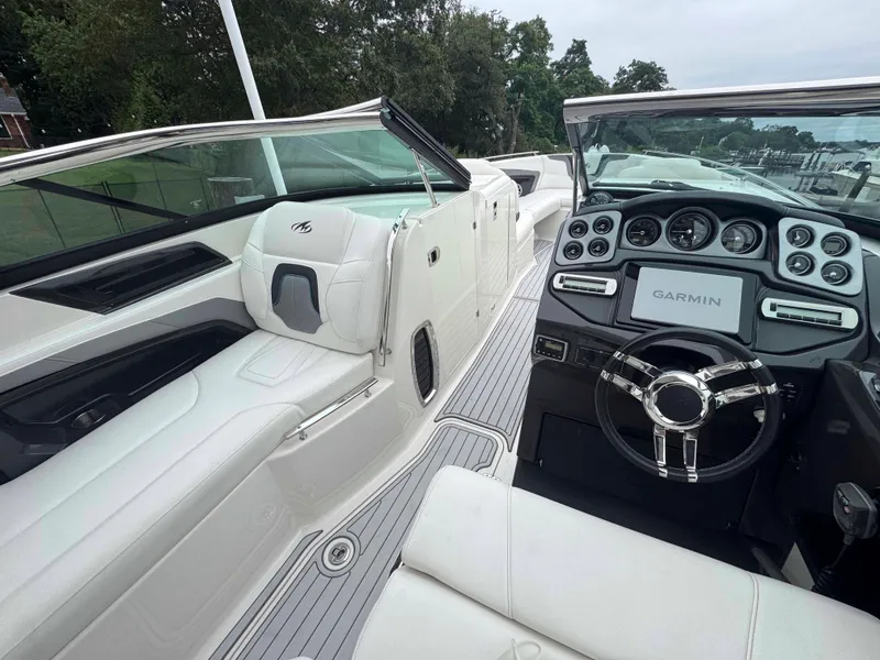Slide: The Image of Interior of a 2013 Monterey 328 Super Sport boat with Garmin navigation system. - 14