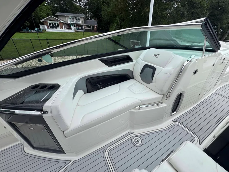 Slide: The Image of Luxurious interior of 2013 Monterey 328 Super Sport boat with white seating and sleek design. - 15