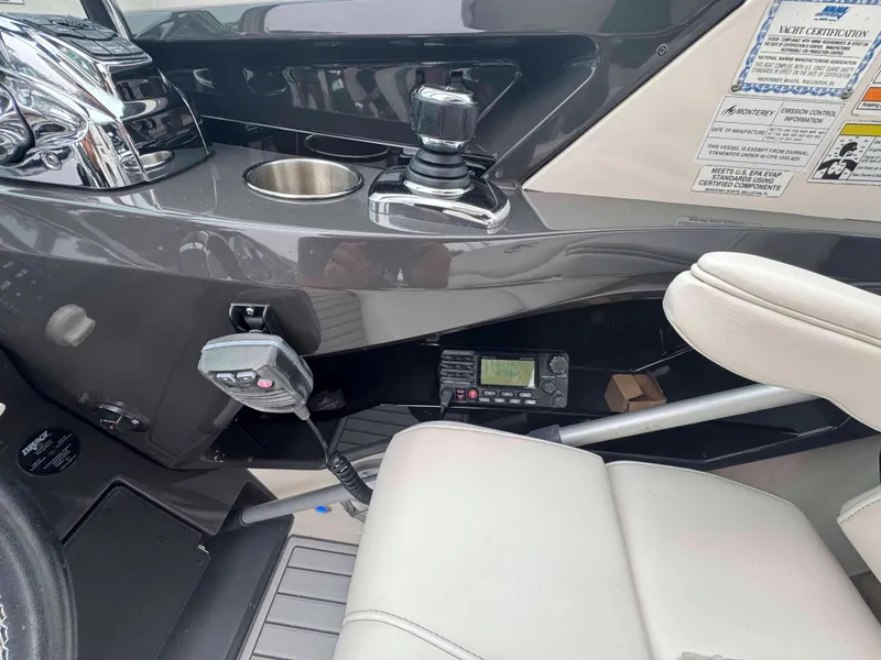 Slide: The Image of Control panel of a 2013 Monterey 328 Super Sport boat with radio and joystick. - 22