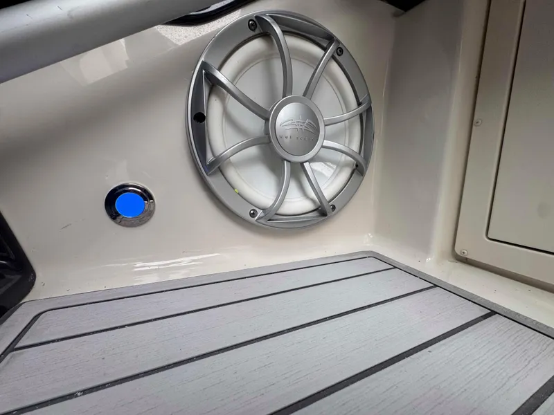 Slide: The Image of 2013 Monterey 328 Super Sport boat interior with speaker and blue button. - 25
