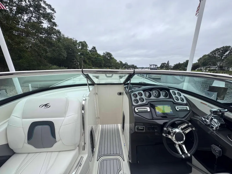 Slide: The Image of 2013 Monterey 328 Super Sport boat interior with modern dashboard and steering wheel. - 27