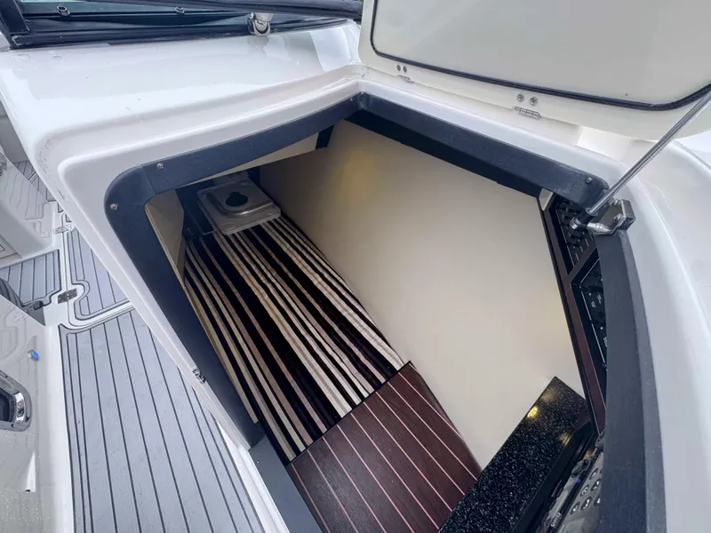 Slide: The Image of Interior cabin of 2013 Monterey 328 Super Sport boat with striped flooring. - 29