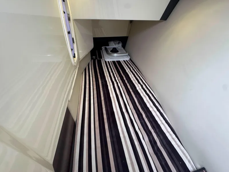 Slide: The Image of Interior cabin of 2013 Monterey 328 Super Sport with striped flooring. - 30