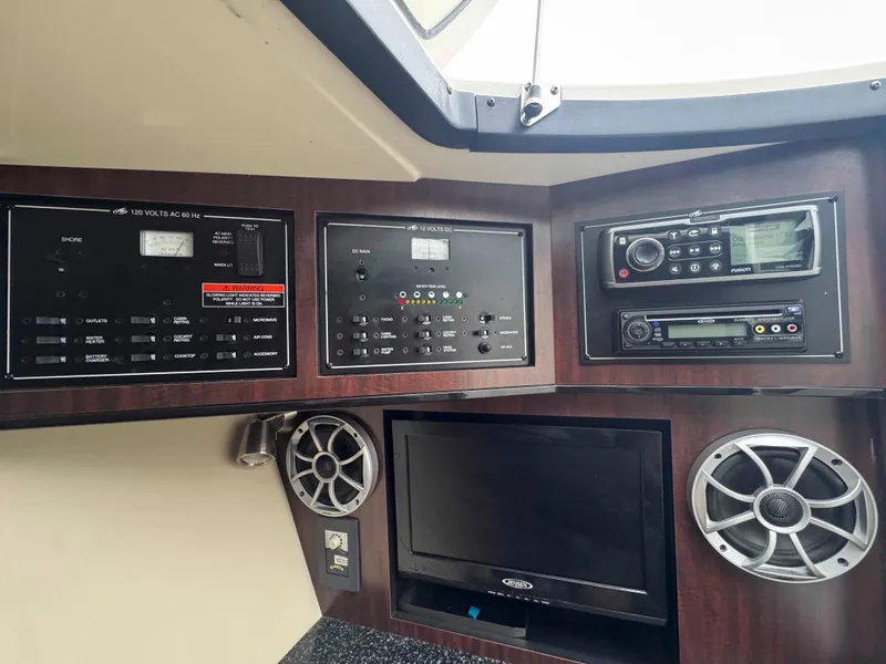 Slide: The Image of Control panel of a 2013 Monterey 328 Super Sport boat with audio system and speakers. - 32