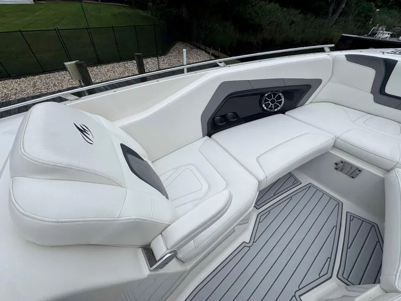 Slide: The Image of 2013 Monterey 328 Super Sport boat interior with white seating and speaker system. - 36