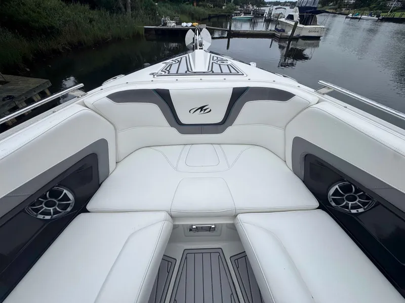 Slide: The Image of 2013 Monterey 328 Super Sport boat interior with white seating and sleek design. - 37
