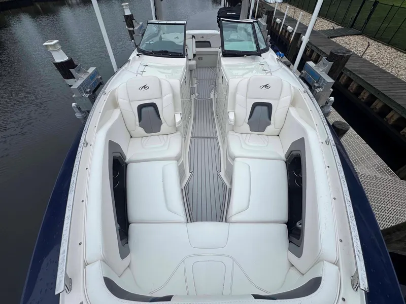Slide: The Image of 2013 Monterey 328 Super Sport boat with white seating and sleek design. - 40