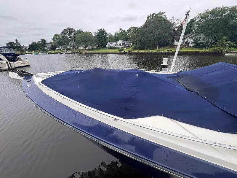 Slide: The Image of 2013 Monterey 328 Super Sport boat docked on a calm river. - 7