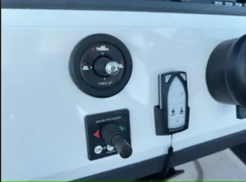 Slide: The Image of Control panel of 2020 Axopar 28 TT boat with various switches and gauges. - 18