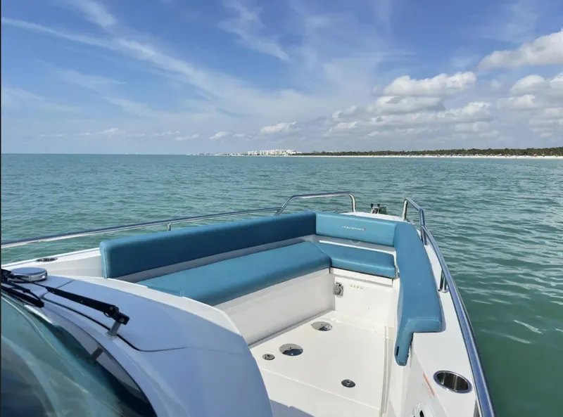 Slide: The Image of 2020 Axopar 28 TT boat on calm sea with blue sky. - 2