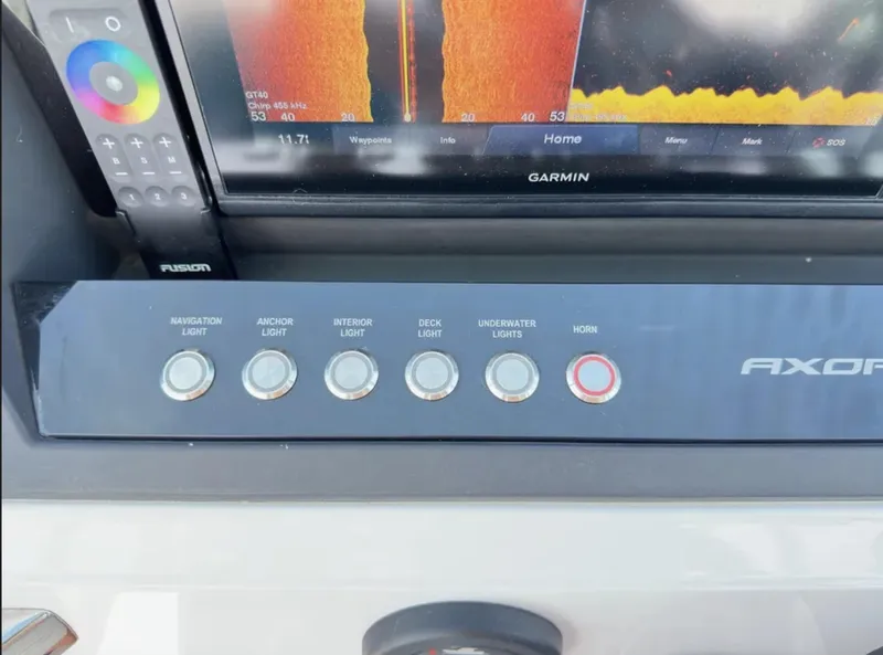 Slide: The Image of Control panel of 2020 Axopar 28 TT boat with navigation and lighting buttons. - 20