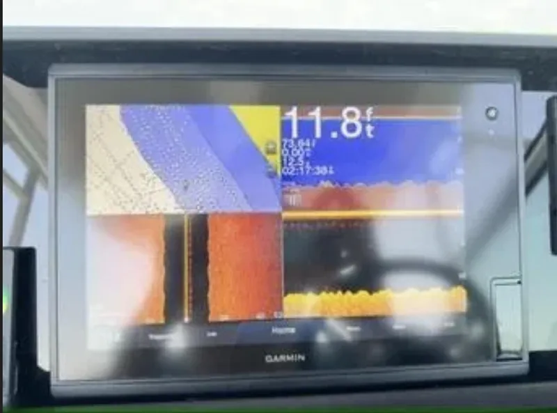 Slide: The Image of Garmin marine display on 2020 Axopar 28 TT showing depth and sonar data. - 23