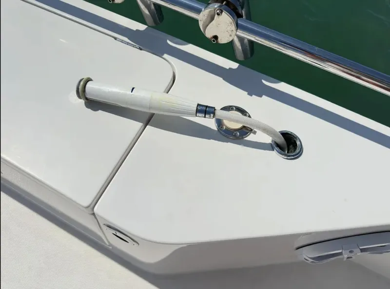 Slide: The Image of Fuel hose on 2020 Axopar 28 TT boat deck, near stainless steel railing. - 7