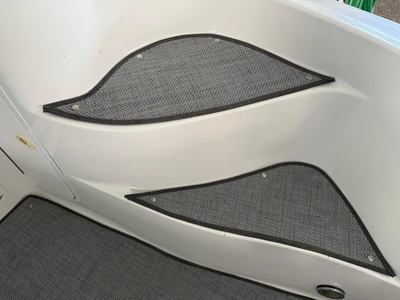 Slide: The Image of 1999 Sea Ray 400 Sedan Bridge interior steps with non-slip gray mats. - 10