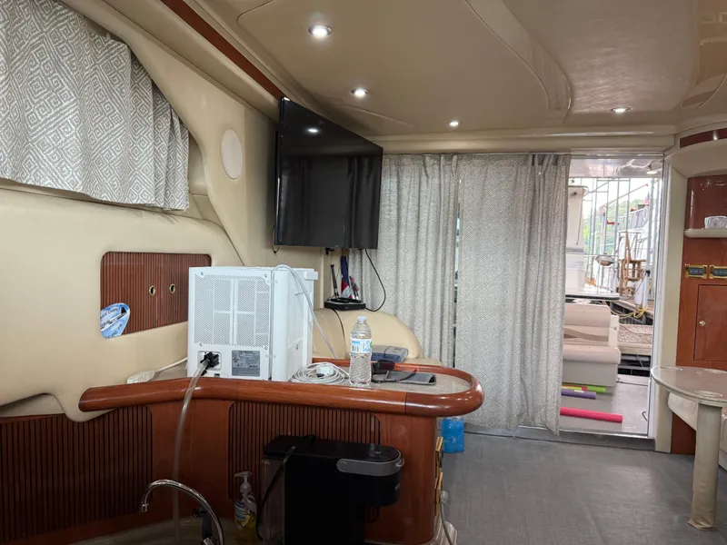 Slide: The Image of Interior of a 1999 Sea Ray 400 Sedan Bridge yacht with modern amenities. - 15