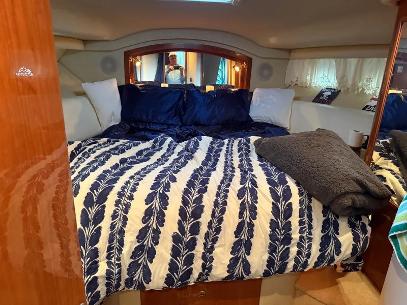 Slide: The Image of Luxurious bedroom interior of 1999 Sea Ray 400 Sedan Bridge yacht. - 20