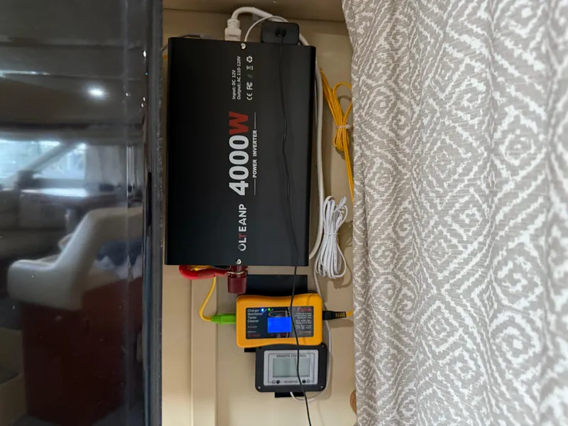 Slide: The Image of Power inverter setup on 1999 Sea Ray 400 Sedan Bridge yacht interior. - 30