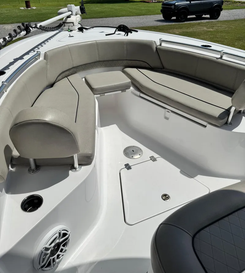 Slide: The Image of 2022 Sportsman Open 242 Center Console boat interior with cushioned seating. - 7