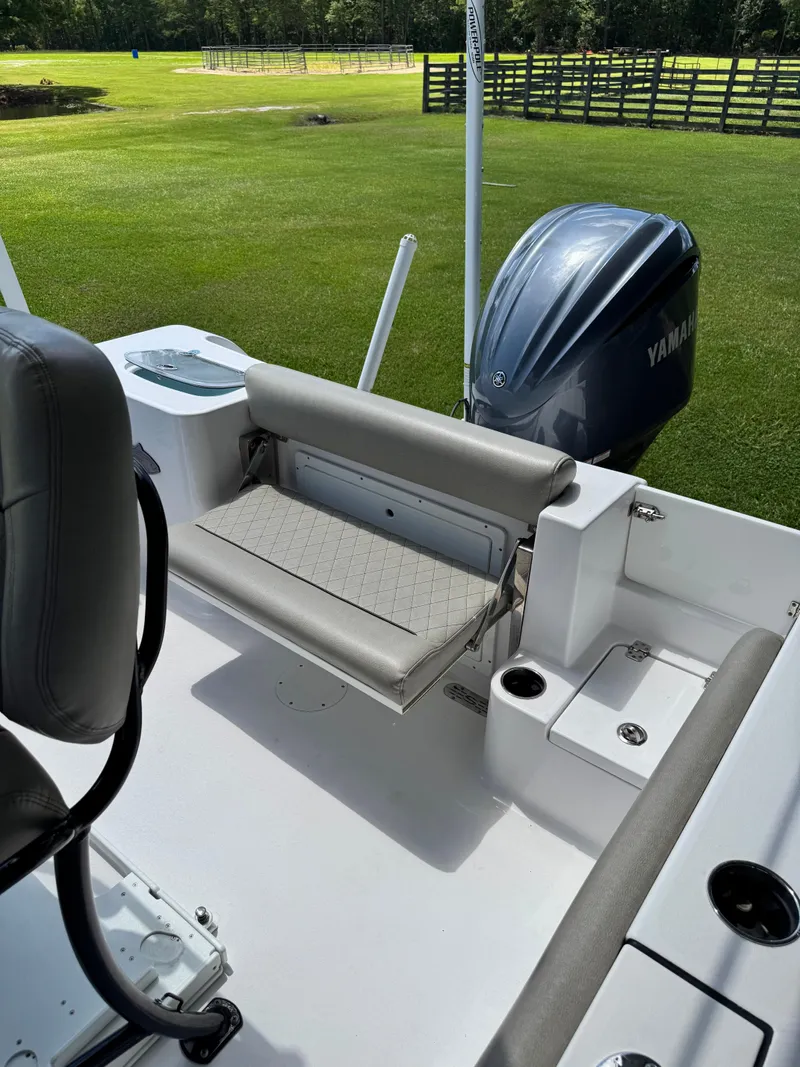 Slide: The Image of 2022 Sportsman Open 242 Center Console boat interior with Yamaha engine. - 8