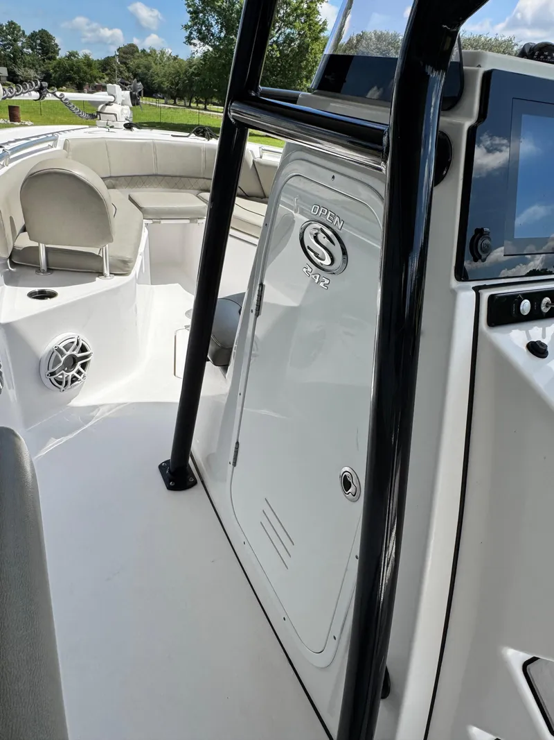 Slide: The Image of 2022 Sportsman Open 242 Center Console boat interior with seating and console details. - 9