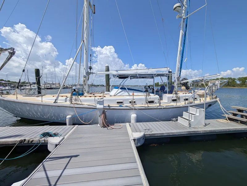 The Image of Sailboat docked at marina, Mason COHORT II, 1976 model, under clear blue sky. - 0