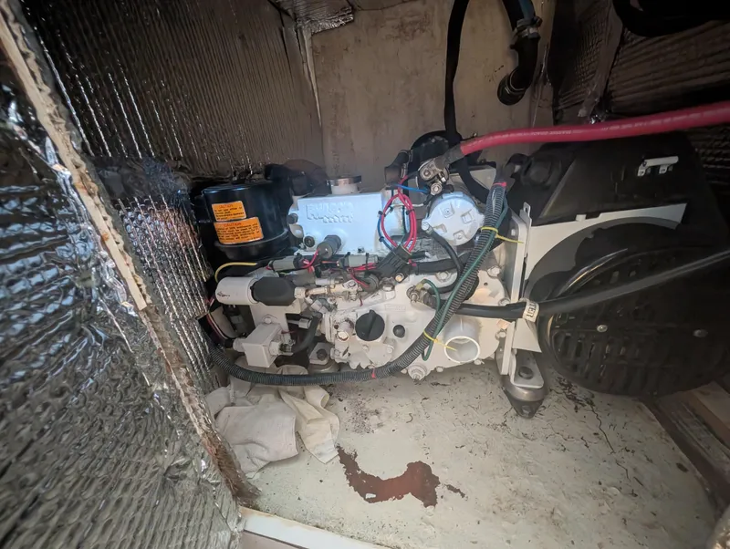 Slide: The Image of 1976 Mason COHORT II engine with wiring and insulation in a compartment. - 12