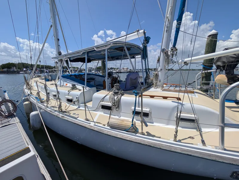 Slide: The Image of 1976 Mason COHORT II sailboat docked at marina under clear blue sky. - 21