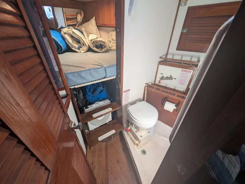 Slide: The Image of Compact cabin interior of 1976 Mason COHORT II with bed and marine toilet. - 6