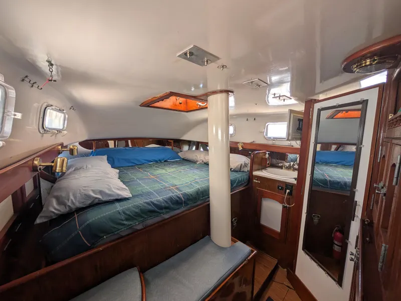 Slide: The Image of Cozy cabin interior of 1976 Mason COHORT II yacht with bed and portholes. - 7