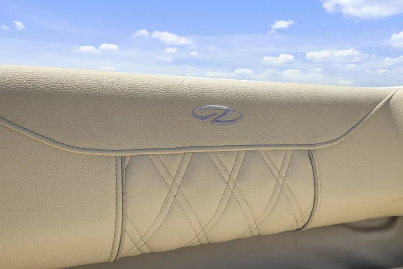 Slide: The Image of Luxurious beige leather interior of 2019 Regal LS4 boat under blue sky. - 15
