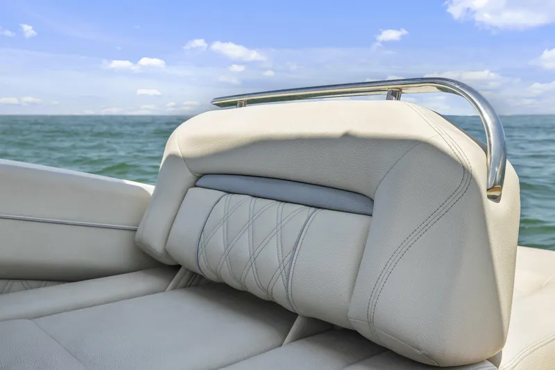 Slide: The Image of 2019 Regal LS4 boat seat with ocean view, featuring luxurious beige upholstery. - 18